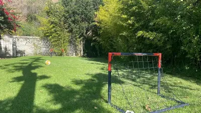 a soccer goal in the middle of a yard at Villa Exclusiva 12 Personas con Piscina, Barbacoa y Vistas al Mar en Maresme Barcelona in Sant Vicenç de Montalt