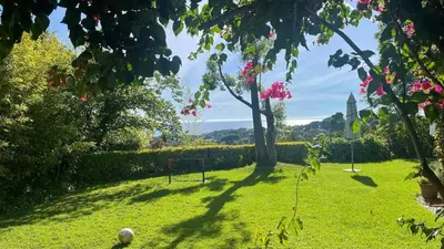 a park with a bench in the grass at Villa Exclusiva 12 Personas con Piscina, Barbacoa y Vistas al Mar en Maresme Barcelona in Sant Vicenç de Montalt