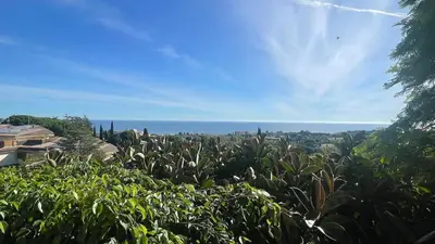 a field of plants with the ocean in the background at Villa Exclusiva 12 Personas con Piscina, Barbacoa y Vistas al Mar en Maresme Barcelona in Sant Vicenç de Montalt