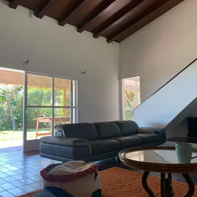 a living room with a couch and a table at Villa Exclusiva 12 Personas con Piscina, Barbacoa y Vistas al Mar en Maresme Barcelona in Sant Vicenç de Montalt
