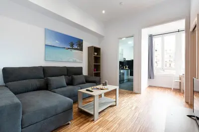 a living room with a couch and a table at 2905 - AB Comte dUrgell I-II in Barcelona