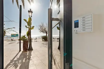 a refrigerator with a view of the beach at Sitges Group Beach Dreams in Sitges