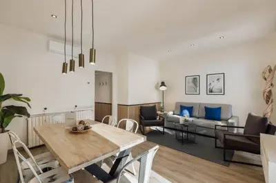a living room with a table and a couch at Sitges Group Beach Dreams in Sitges