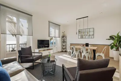 a living room with a couch and a table at Sitges Group Beach Dreams in Sitges