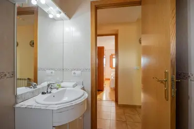 a bathroom with a sink and a mirror at Mas Prat in Pla del Panadés