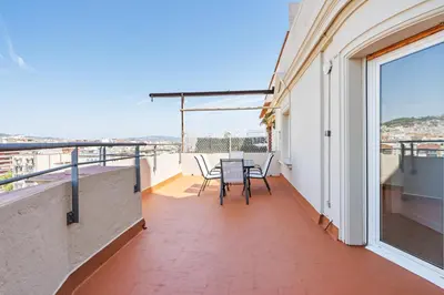 a balcony with a table and chairs on it at 4151 - AB Sagrada Familia Views VII-II in Barcelona