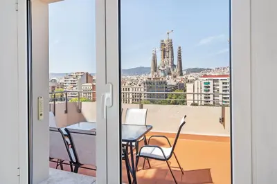 a view from a balcony with a table and chairs at 4151 - AB Sagrada Familia Views VII-II in Barcelona
