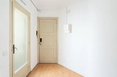 an empty room with a door and a wooden floor at 4151 - AB Sagrada Familia Views VII-II in Barcelona