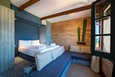 a bedroom with a large bed and a window at Barcelona apartment with sea view in Barcelona