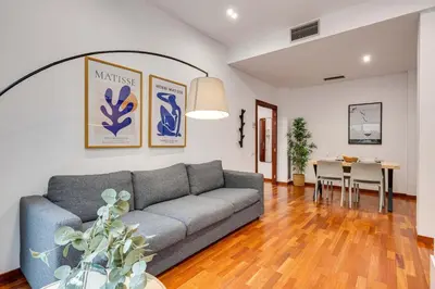 a living room with a couch and a table at Acogedor apartamento en el corazón de Sant Antoni in Barcelona