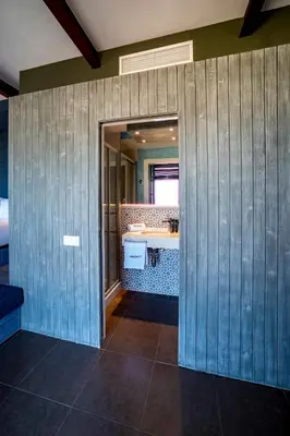 a bathroom with a sink and a mirror at Beach apartment with sea views in Barcelona