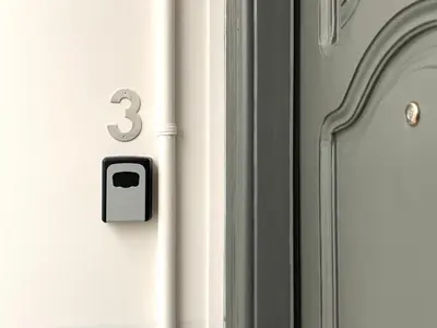 a white door with a number three on it at MadreMia - Wow Hub Barcelona in Hospitalet de Llobregat