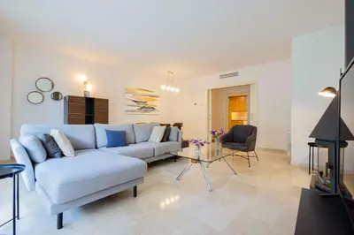 a living room with a couch and a table at Apartment for 6, spacious and bright in Bonanova in Barcelona