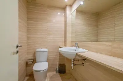 a bathroom with a toilet and a sink at Apartment for 6, spacious and bright in Bonanova in Barcelona