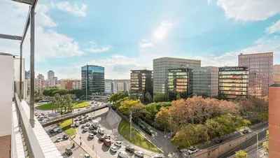 a view of a city with cars parked on a street at Penthouse with Terrace near Gran Via and Camp Nou in Barcelona
