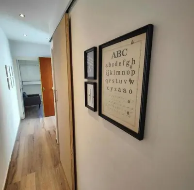 a picture hanging on a wall in a room at Bright and cozy 2 rooms apartment in Hospitalet de Llobregat
