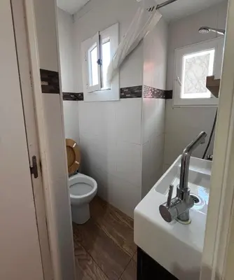 a bathroom with a sink and a toilet at Bright and cozy 2 rooms apartment in Hospitalet de Llobregat