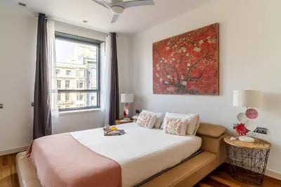 a bedroom with a large bed and a window at 4101 - AB Passeig de Gràcia Plaça Catalunya I in Barcelona