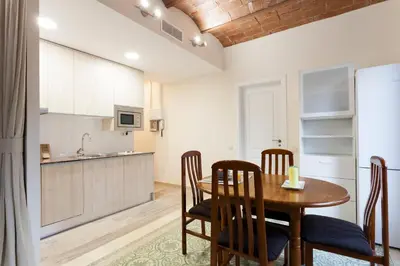 a kitchen and dining room with a table and chairs at 2582 - AB Sagrada Familia Marina in Barcelona