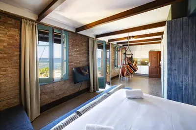 a room with a bed and a view of the ocean at Barceloneta Mar Beach - BM32 in Barcelona