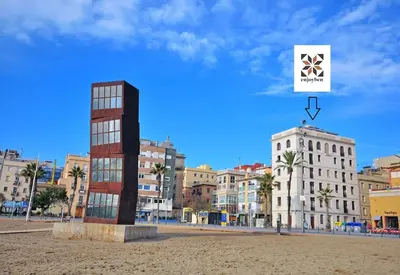 a view of a city with buildings and a sign at Barceloneta Mar Beach - BM32 in Barcelona