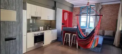a kitchen with a hammock hanging from the ceiling at Barceloneta Mar Vela -BM14 in Barcelona