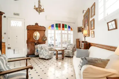 a living room with a couch and chairs at HomeHolidaysRentals Suria - Costa Barcelona in San Pol de Mar