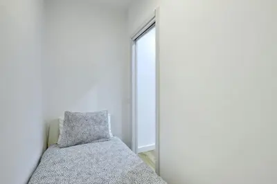 a bedroom with a bed next to a mirror at Ro Lively and bright apartment next to Blai st in Barcelona