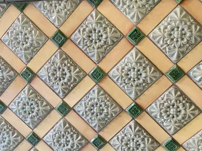 a close up of a tiled wall in a bathroom at Gran Via City Center Apartment in Barcelona