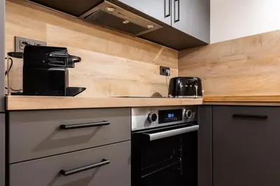 a kitchen with a stove and a counter top at Petit Luxe Del Vall in Terrassa
