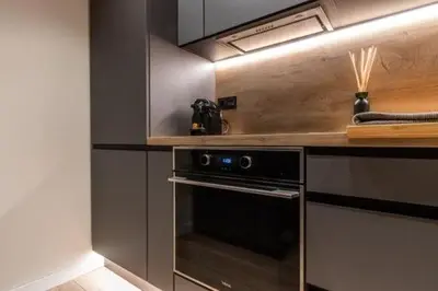 a kitchen with a stove and a counter top at Petit Luxe Mutua in Terrassa