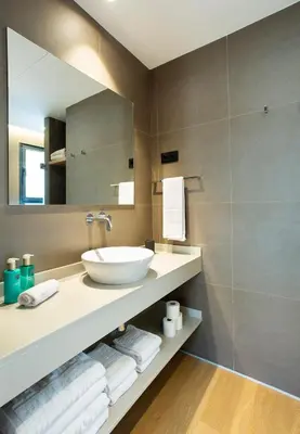 a bathroom with a sink and a mirror at Durlet Suites by Durlet Apartments in Barcelona