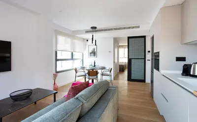 a living room with a couch and a table at Durlet Suites by Durlet Apartments in Barcelona