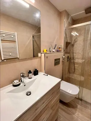 a bathroom with a sink and a shower and a toilet at Precioso apartamento al lado de Barcelona centro in Sant Feliu de Llobregat