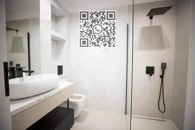 a white bathroom with a sink and a shower at My White Vilanova Home in Vilanova i la Geltrú
