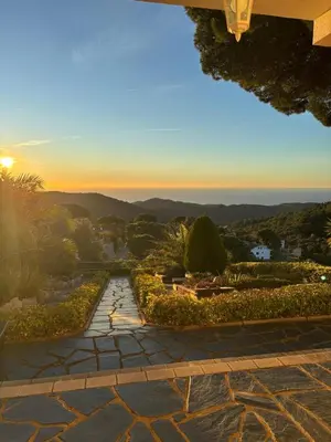a view of the sunset from the patio of a house at Parc du Montnegre avec magnifique vue mer in Tordera