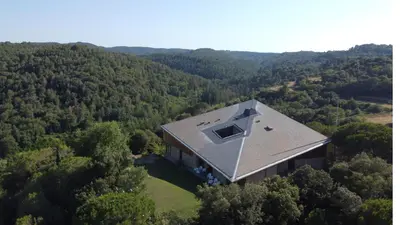 an aerial view of a house in the middle of a forest at Casakubrick mansión in Castelltersol