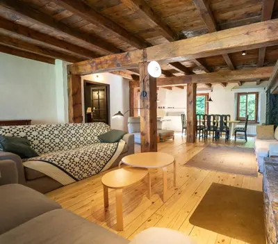 a living room with a couch and a table at Apartamento montaña en Arties in Artés