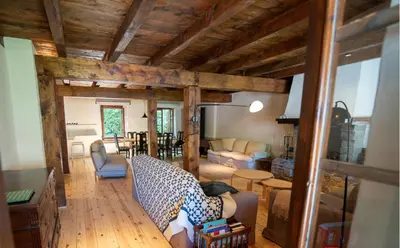 a living room with a couch and a table at Apartamento montaña en Arties in Artés