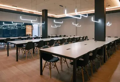 a conference room with tables and chairs and lights at BLAU Student Housing - Students Only in Barcelona