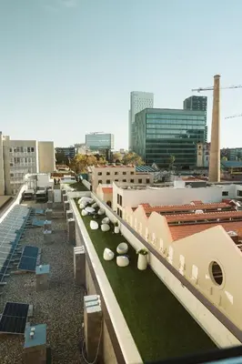 a view of the rooftop of a building with green roofs at BLAU Student Housing - Students Only in Barcelona