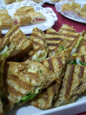 a plate of grilled cheese sandwiches on a table at Hotel Iris in Granollers