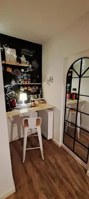 a room with a table and a chair in a room at SUITE Bougainvillea in Lliçà d'Amunt