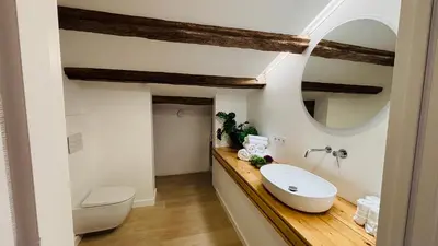 a bathroom with a sink and a mirror at Céntrico ático by Prestigi in Terrassa