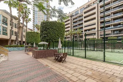 a patio with a fence and a bench in a city at 4168 - AB Josep Pla- Diagonal Mar in Barcelona