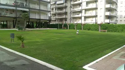 a large grassy area in a building with a park at Sea Views Penthouse in Sitges