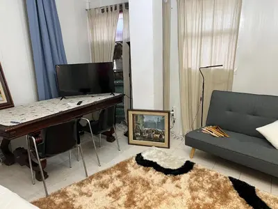 a living room with a piano and a couch at Tessasapartments Sabadell 4 in Sabadell