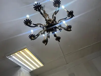 a chandelier hanging from a ceiling in a room at Tessasapartments Sabadell 4 in Sabadell