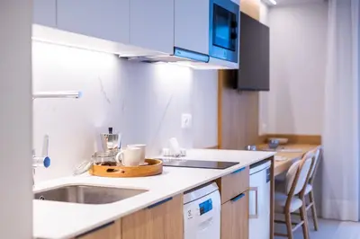 a kitchen with a sink and a counter at Fels Apartments in Castelldefels