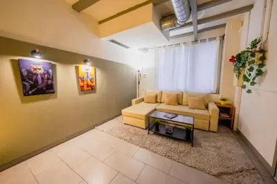 a living room with a couch and a table at rentBCN Paseo de Gracia Apartments in Barcelona